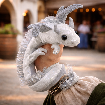white iridescent dragon wristlet puppet coiled in a soft curved shape on white background
