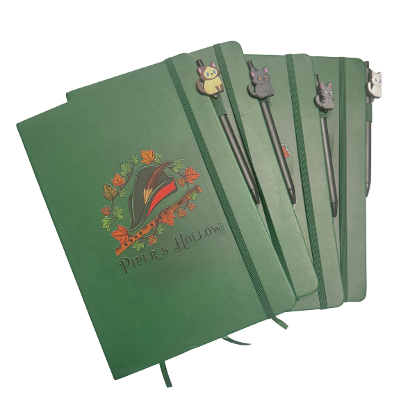 green lined journal with elastic band and cat pen set on white background