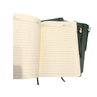 green lined journal with elastic band and cat pen set on white background