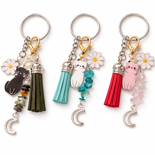 cat charm keychains with tassels and gemstone beads in multiple colors on white background