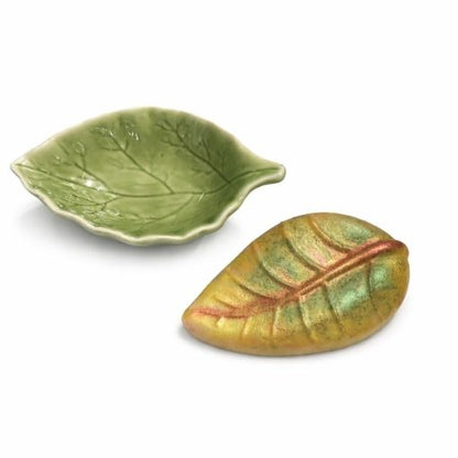 leaf shaped goat milk soap with matching green ceramic leaf dish on white background