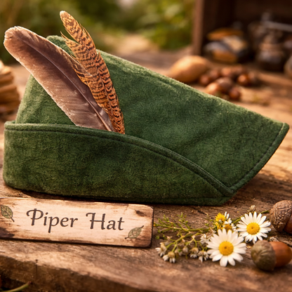green woodland hat with feather detail resting on rustic wooden table with natural forest elements